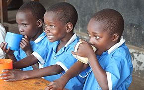 Picture of children drinking milk in Uganda